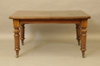 Lot 590 - A Victorian mahogany wind out dining table