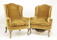 Lot 600 - A pair of wing back armchairs