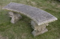 Lot 1109 - A curved stone garden seat