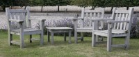 Lot 1090 - Three Barlow Tyrie teak slatted garden armchairs