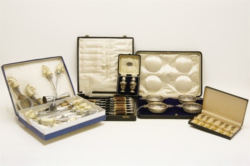 Lot 227 - A cased pair of silver pepparettes