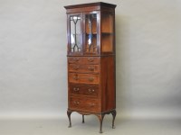 Lot 546 - An Edwardian mahogany inlaid glazed bookcase end over five graduated drawers