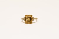 Lot 32 - A 9ct gold single stone emerald cut citrine ring
