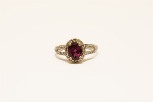 Lot 38 - A 9ct white gold garnet and diamond cluster ring