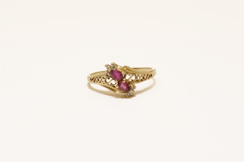 Lot 20 - A gold ruby and diamond crossover ring