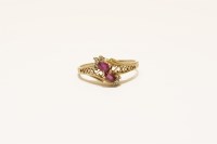 Lot 20 - A gold ruby and diamond crossover ring