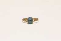 Lot 30 - A gold single stone blue topaz ring