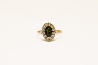Lot 21 - A 9ct gold tourmaline and diamond illusion set cluster ring