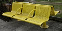 Lot 1078 - A British Rail back to back yellow painted bench