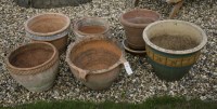 Lot 1075 - Six large terracotta and glazed garden pots