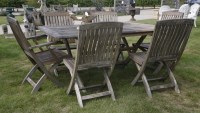 Lot 1067 - An Alexander Rose slatted teak garden table and six chairs