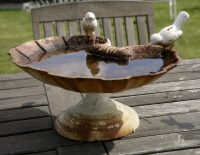 Lot 1065 - A cast iron bird bath