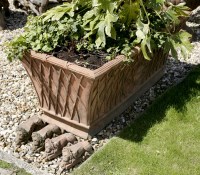 Lot 1062 - A terracotta style planter