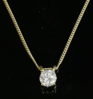 Lot 304 - An 18ct gold single stone diamond pendant