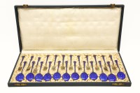 Lot 169 - A cased set of enamel and silver gilt dessert forks and spoons