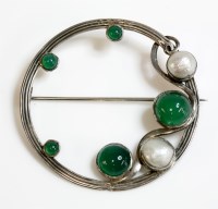 Lot 17 - An Arts and Crafts silver agate and blister pearl circle brooch
