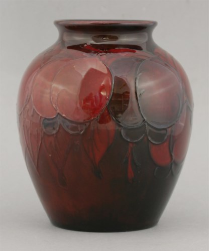 Lot 139 - A Moorcroft pottery flambé 'Leaf and Berry' vase