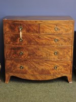 Lot 492 - A 19th century strung mahogany bow front chest