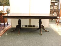 Lot 524 - A modern hardwood twin pillar dining table