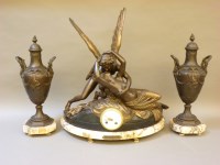 Lot 285 - A late 19th century spelter clock garniture