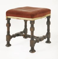 Lot 511 - A walnut foot stool