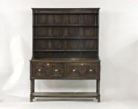 Lot 557 - An early 20th century dark oak dresser