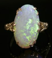 Lot 365 - An Edwardian single stone opal ring