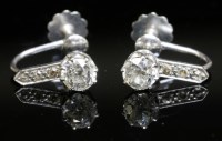 Lot 394 - A pair of Art Deco single stone diamond stud earrings