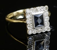 Lot 433 - A rectangular sapphire and diamond cluster ring