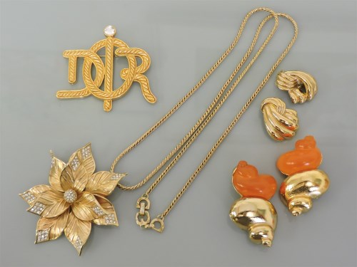 Lot 19 - A Christian Dior gold plated poinsettia pendant