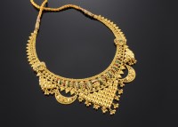 Lot 515 - An Indian high carat gold enamel and gold bead necklace