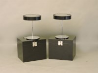 Lot 449 - A pair of black lacquered bedside tables