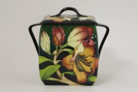 Lot 1185 - A Moorcroft 'Magnolia' biscuit jar and cover