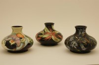 Lot 1209 - Three Moorcroft squat vases