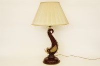 Lot 384 - A ruby glass and aventurine dolphin lamp base