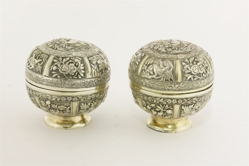 Lot 411 - Two Chinese parcel-gilt silver pots and covers