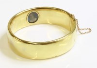 Lot 302 - A cased gold hinged bangle