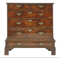 Lot 413 - A walnut and crossbanded chest on stand