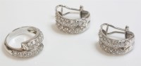 Lot 1017 - A white gold paste set crossover ring