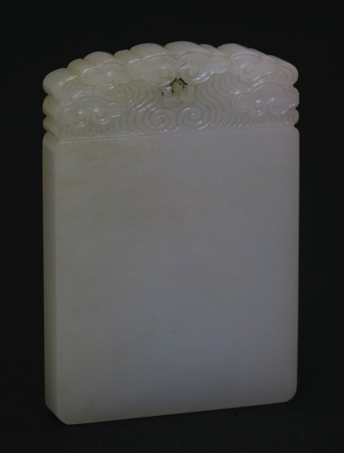 Lot 180 - A white jade 'Ping An Wu Shi' Pendant