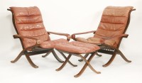 Lot 638 - A pair of Westnofa stained beech folding lounge armchairs
