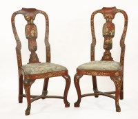 Lot 558 - A pair of red lacquered single chairs