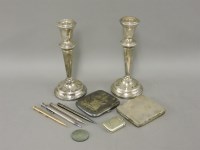 Lot 145 - A pair of silver candlesticks