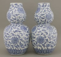 Lot 41 - A pair of blue and white double gourd Vases