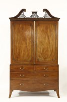 Lot 474 - A George III strung mahogany linen press