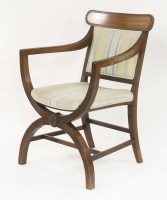 Lot 480 - A Regency style mahogany 'X' frame reeded open armchair