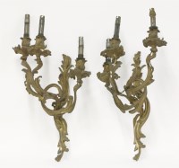 Lot 631 - A pair of gilt bronze three-branch wall lights