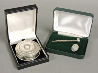 Lot 381 - A modern cased white metal mounted tape measure