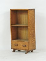 Lot 492 - A Cotswold School oak open shelf