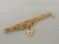 Lot 19 - A gold three row gate link bracelet